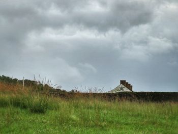 House on field against sky