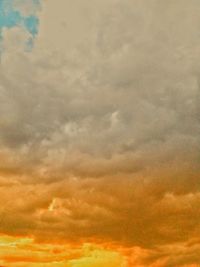 Low angle view of dramatic sky during sunset