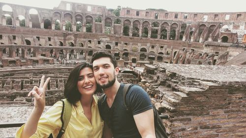 Portrait of smiling young couple outdoors