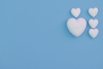 Close-up of heart shape over white background