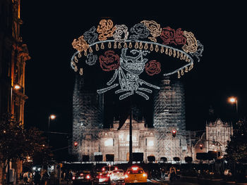 Low angle view of illuminated buildings at night