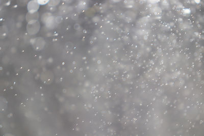 Full frame shot of raindrops on snow