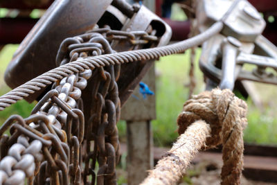 Close-up of rope tied to metal pole
