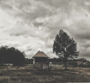 Built structure on field against sky