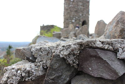 Close-up of stone wall against clear sky