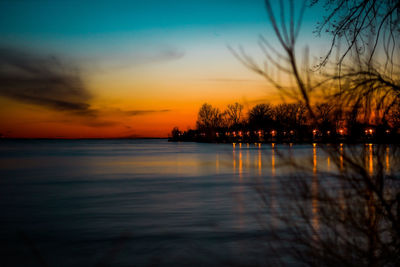 Scenic view of sea against romantic sky at sunset