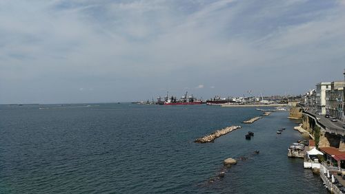 Panoramic view of bay against sky