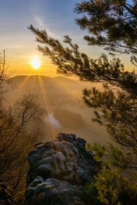 Saxon swiss scenic view of rocks against sky during sunset