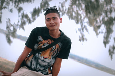 Portrait of a handsome young man standing outdoors