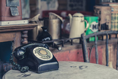 Close-up of old telephone on table