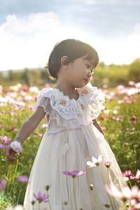 Full length of cute girl standing on field