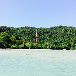 Scenic view of calm sea against clear sky