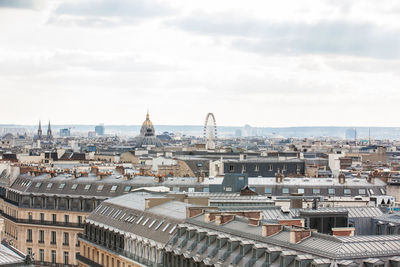 High angle view of buildings in city against sky