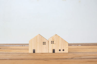 Close-up of wooden table against sky