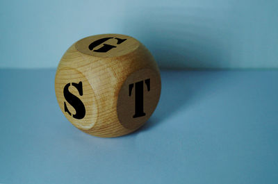 Close-up of alphabets on block over table