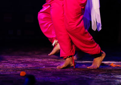 Low section of women dancing on stage