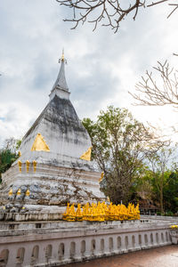 View of temple building against cloudy sky