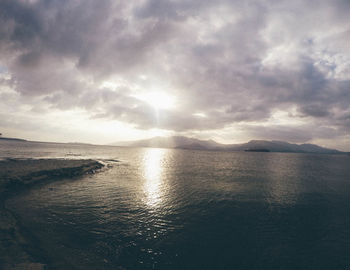 Scenic view of sea against cloudy sky