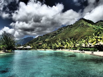 Scenic view of lake against cloudy sky