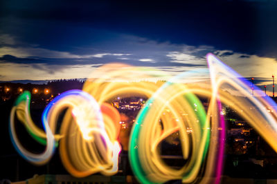 Light trails against sky at night