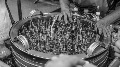 Midsection of vendor selling kulfi