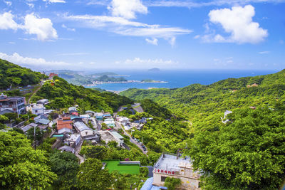 Scenic view of townscape by building against sky