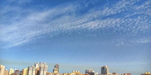 Low angle view of buildings against blue sky