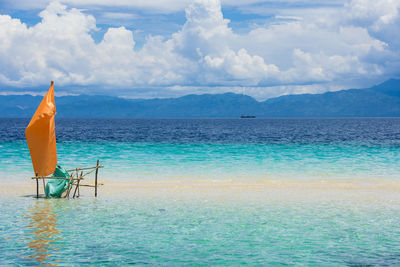 Scenic view of turquoise colored sea against sky