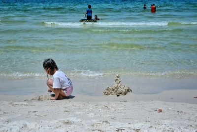 Woman standing on beach