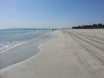 Scenic view of beach against clear sky