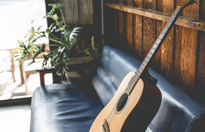 Close-up of guitar on table at home