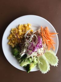 High angle view of chopped vegetables in plate on table