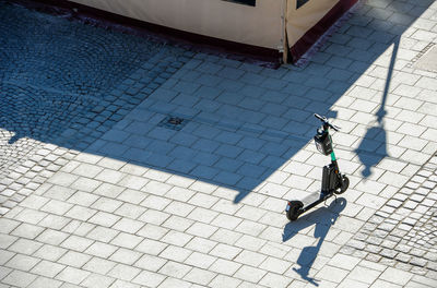 High angle view of woman walking on footpath