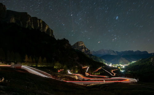 Scenic view of mountains against sky at night