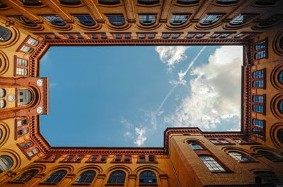 Low angle view of built structure against blue sky