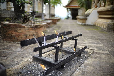 View of lit candles outdoors