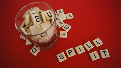 High angle view of text on red table