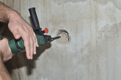 Man working on wall