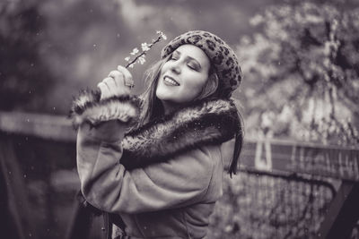 Portrait of a smiling young woman in winter