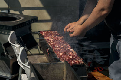 Midsection of man preparing food