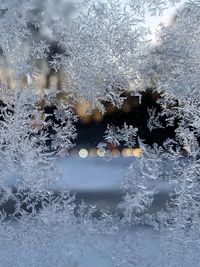 Full frame shot of snowflakes on glass window