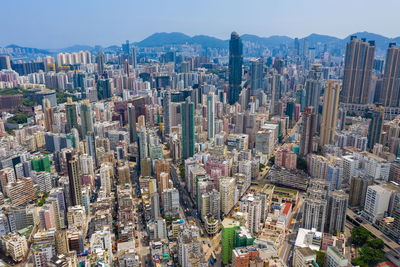 Aerial view of modern buildings in city against sky