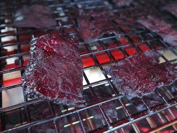 Close-up of meat on barbecue grill