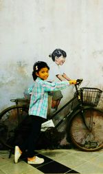 Boy playing with bicycle