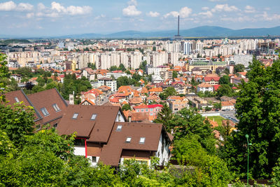 Buildings in town against sky
