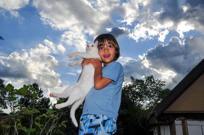 Portrait of boy against sky