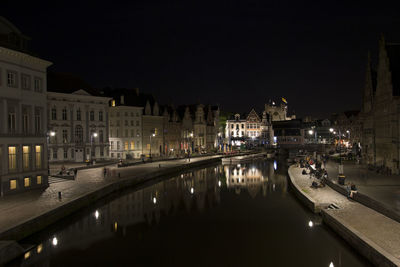 Reflection of gent by  water at night