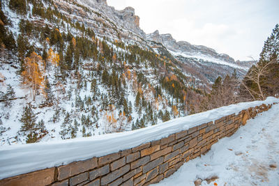 Scenic view of snow covered mountains against sky