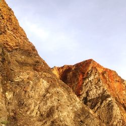 Low angle view of rock formation against sky