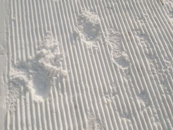 Full frame shot of snow on sand
